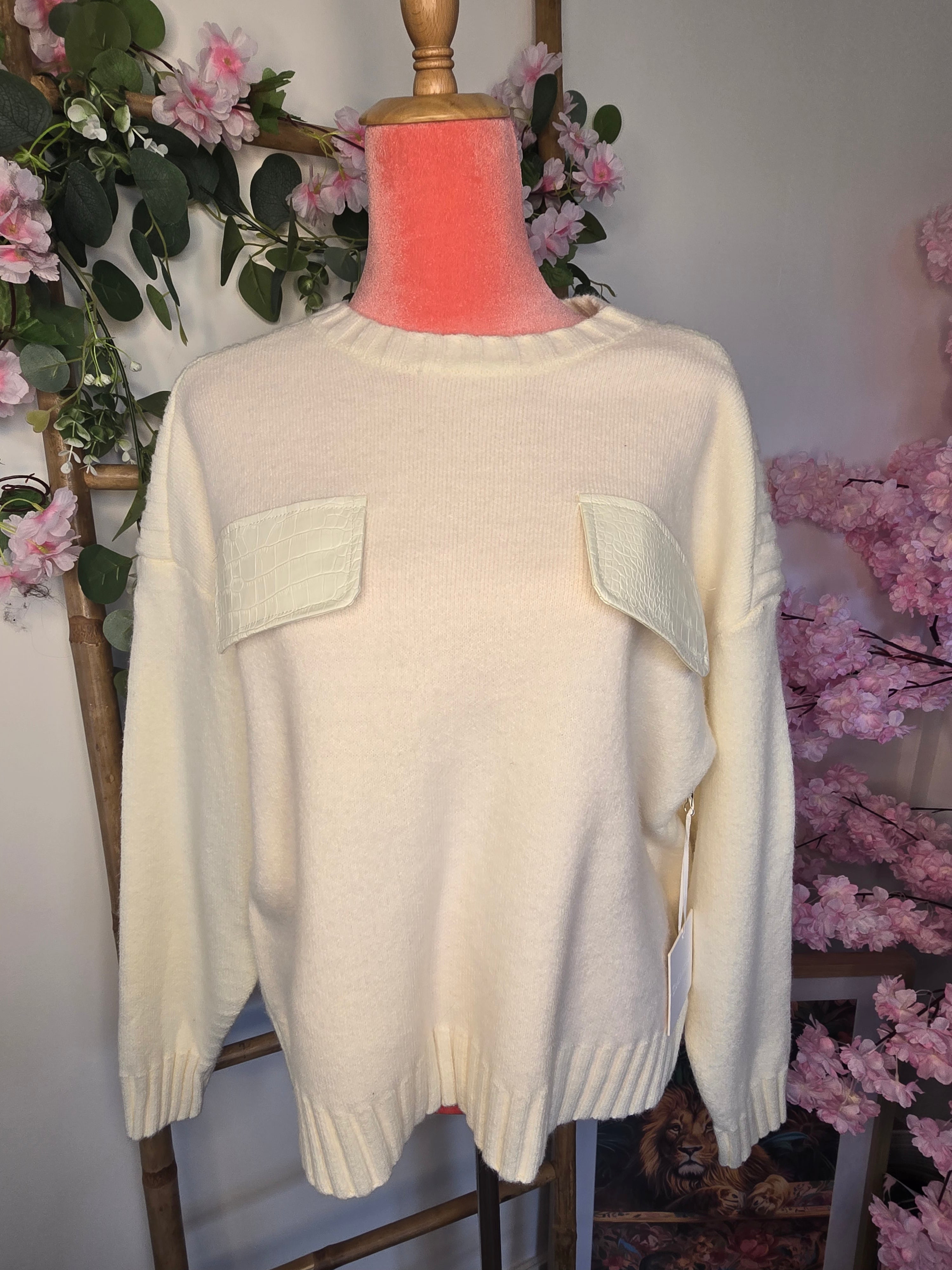 Pull maille poche simili.